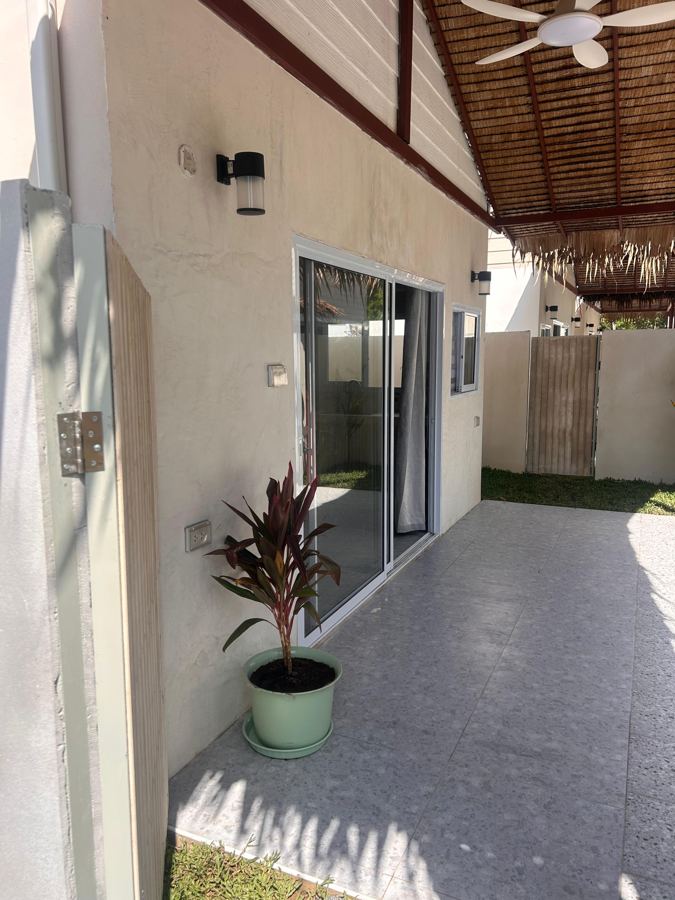 Covered terrace and sliding door to the studio
